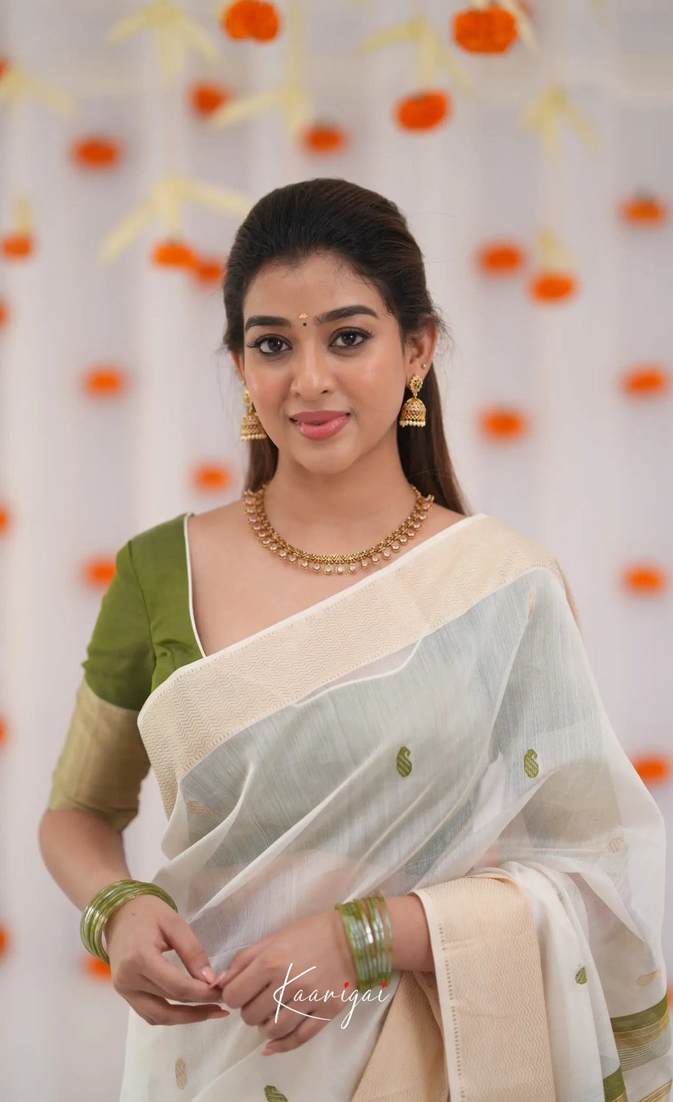 Elegant White Cotton Saree with Olive Green Border – Minimal Festive Look