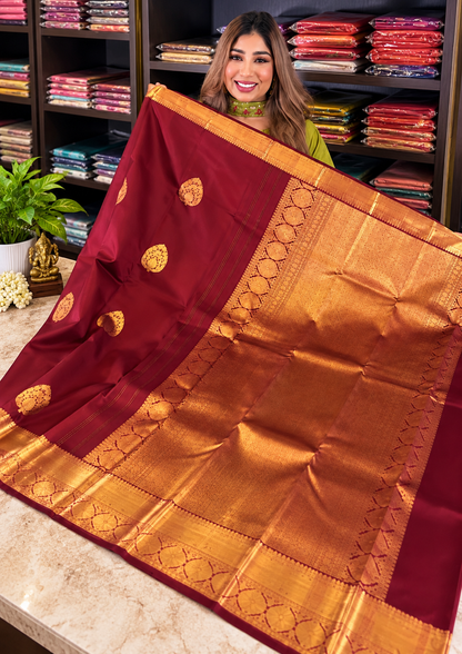 Festive Maroon Soft Banarasi Silk Saree with Elegant Gold Zari Paisley Motifs