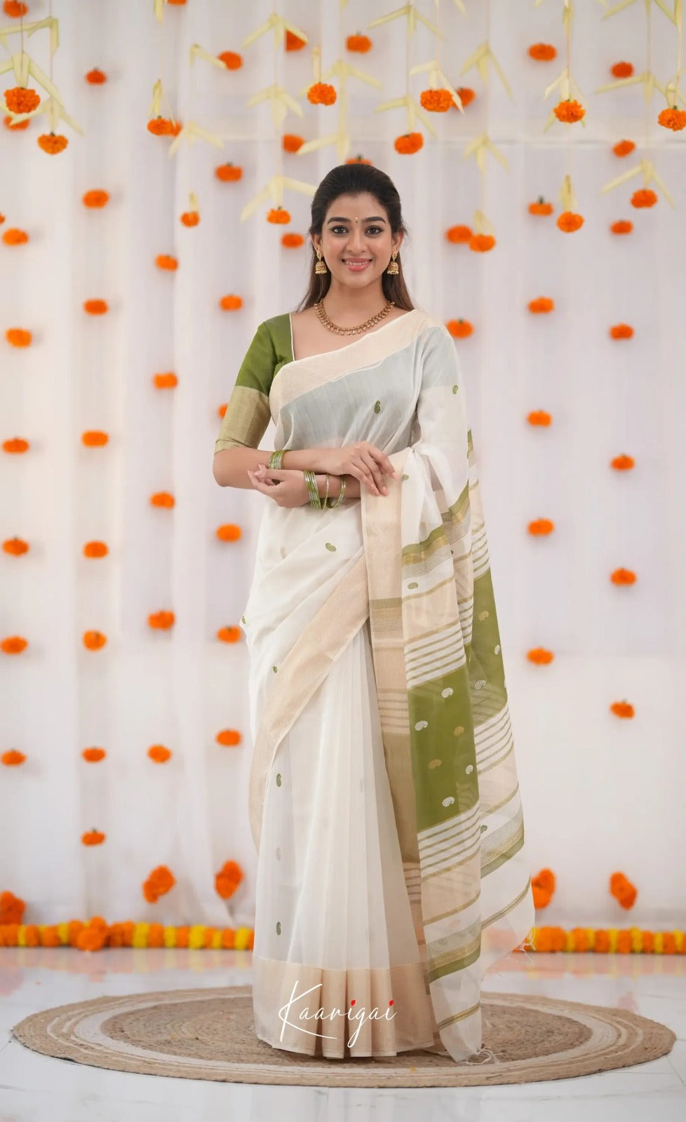 Elegant White Cotton Saree with Olive Green Border – Minimal Festive Look