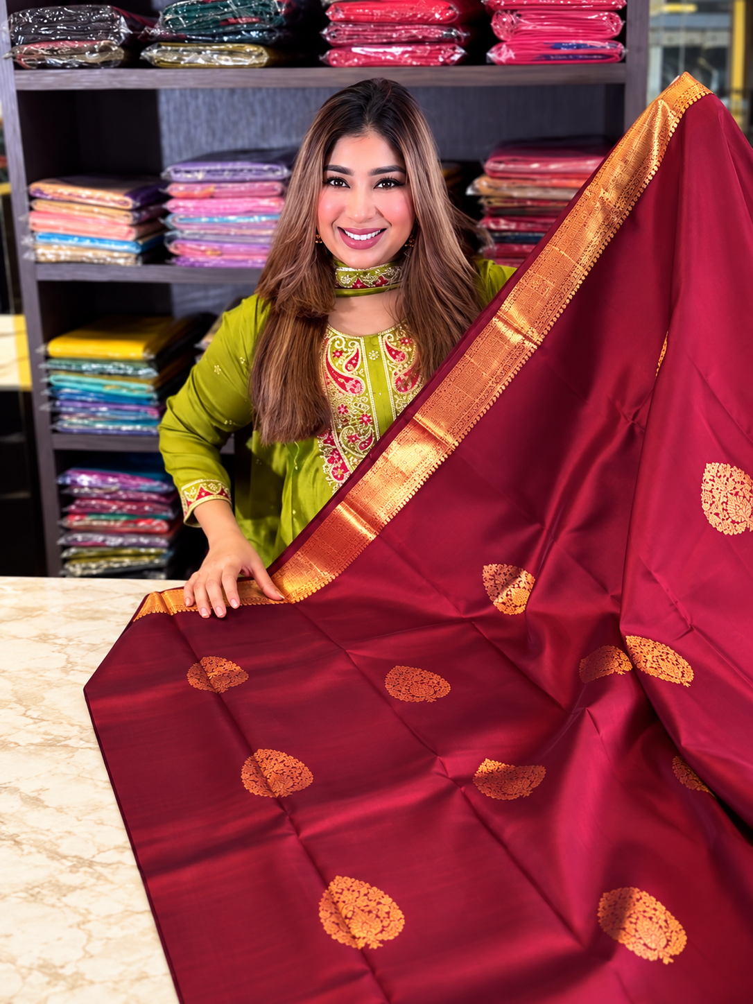 Festive Maroon Soft Banarasi Silk Saree with Elegant Gold Zari Paisley Motifs