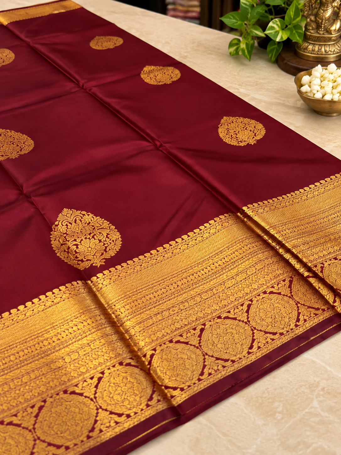 Festive Maroon Soft Banarasi Silk Saree with Elegant Gold Zari Paisley Motifs