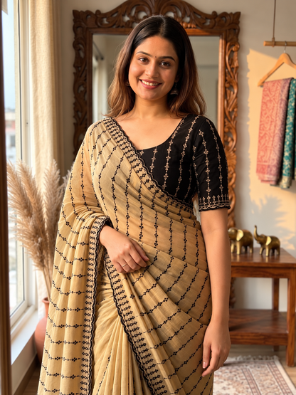 The Beige  Black Motif Striped Saree with a Statement Contrast Blouse
