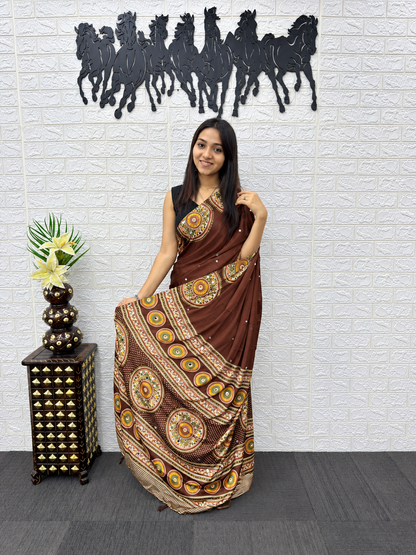 Glamorous Japan Satin Silk Ethnic Saree with Heavy Mirror Work & Elegant Latkans