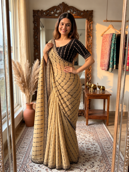 The Beige  Black Motif Striped Saree with a Statement Contrast Blouse