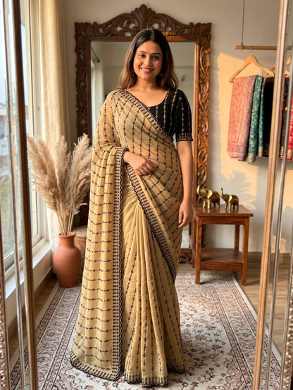 The Beige  Black Motif Striped Saree with a Statement Contrast Blouse