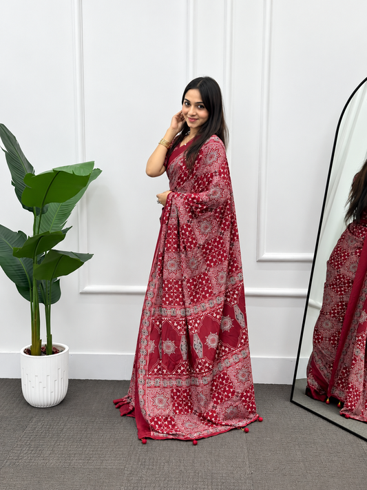 The Kiara  Deep Saffron Maroon Premium Crepe Silk Saree In All Over Classic Print With Matching Blouse Piece