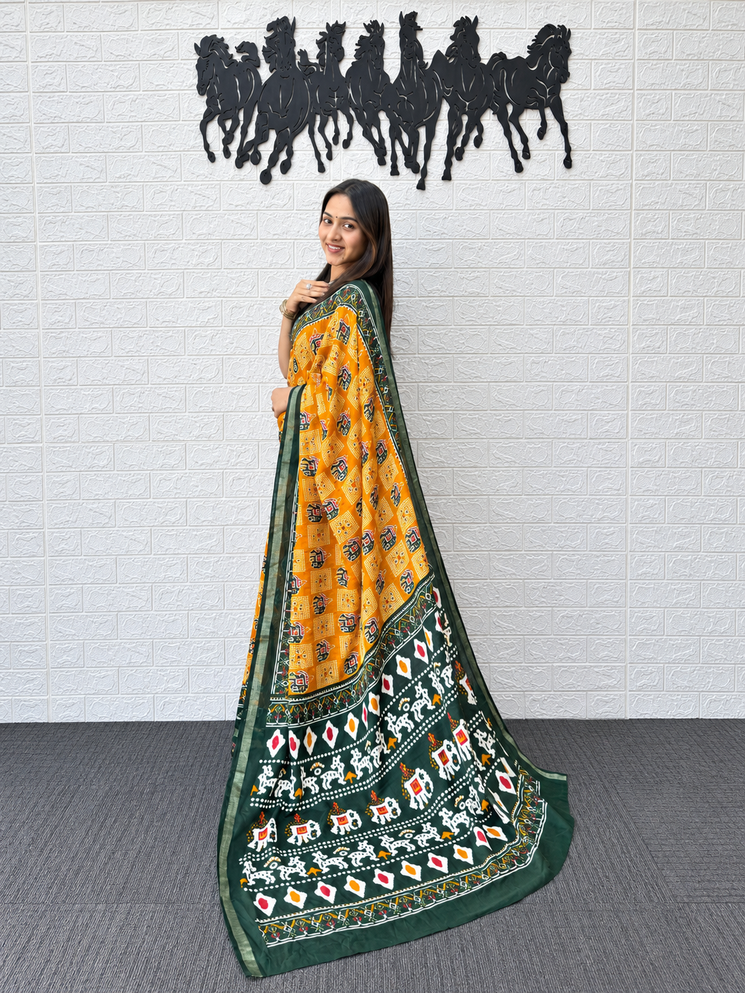 Vibrant Yellow Patola Print Saree in Heavy Mall Cotton with Deep Green Traditional Border