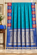 Peacock Cyan Kanchipuram Blend Saree Framed in Crimson and Royal Blue Block Borders