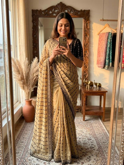 The Beige  Black Motif Striped Saree with a Statement Contrast Blouse