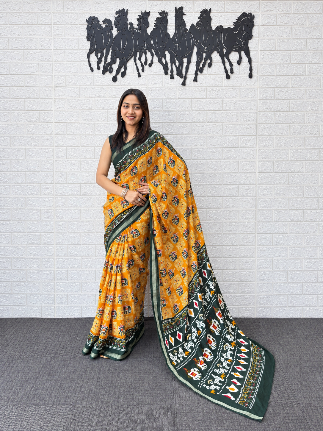 Vibrant Yellow Patola Print Saree in Heavy Mall Cotton with Deep Green Traditional Border