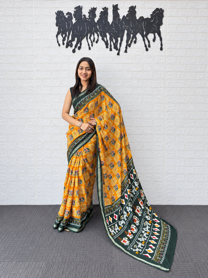 Vibrant Yellow Patola Print Saree in Heavy Mall Cotton with Deep Green Traditional Border