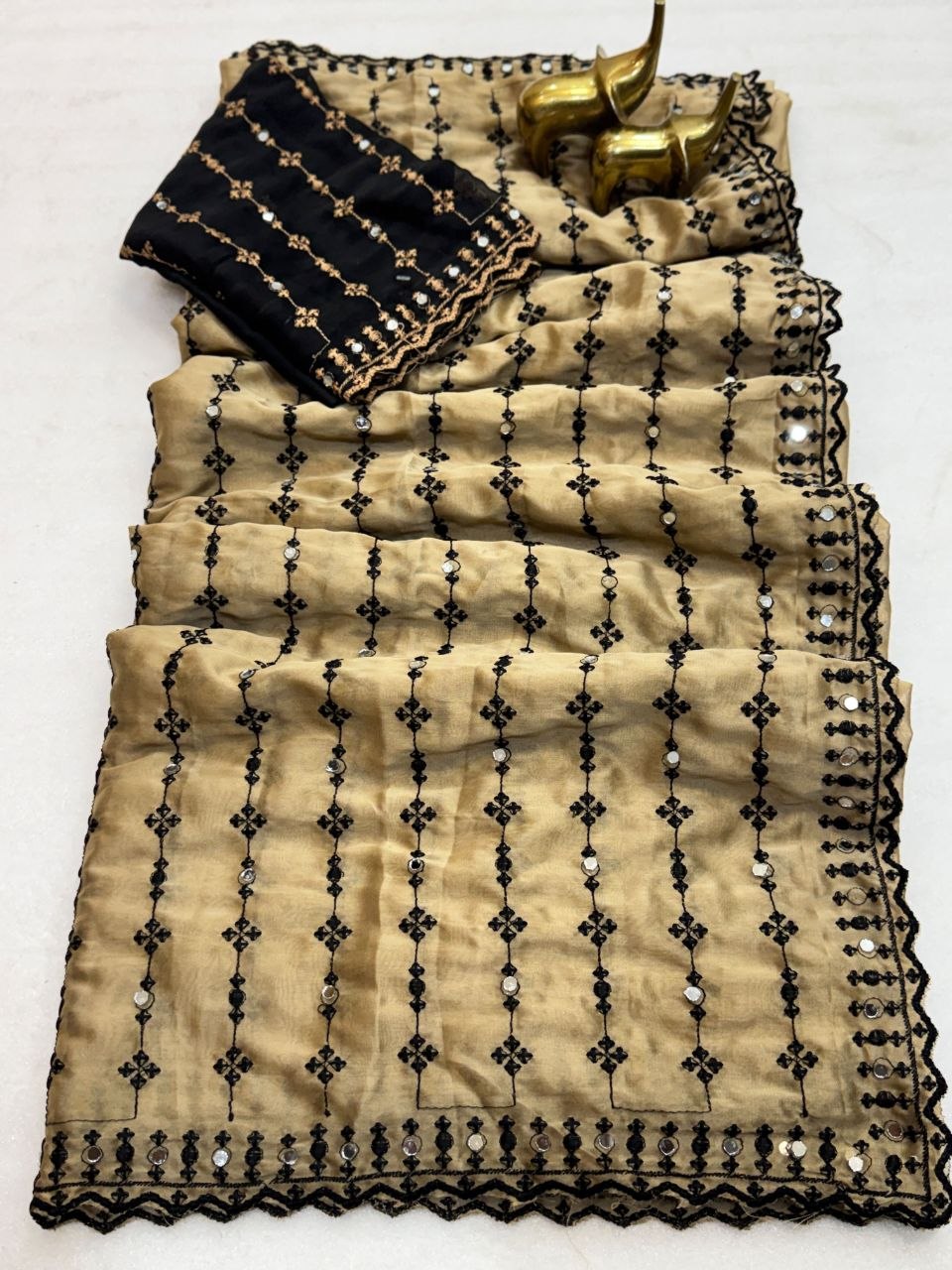 The Beige  Black Motif Striped Saree with a Statement Contrast Blouse