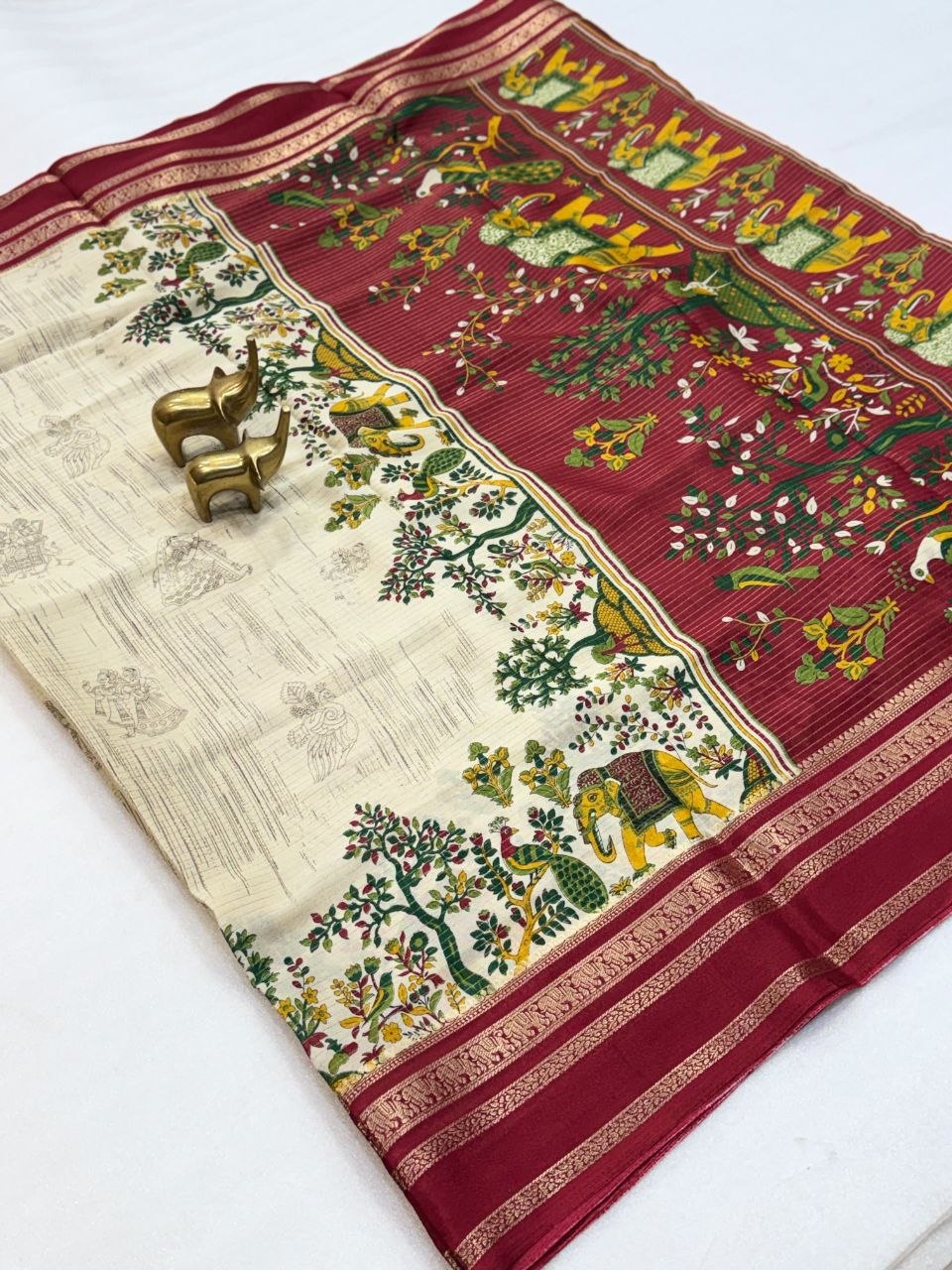 Aarohi Cream & Maroon Saree with Artistic Peacock and Elephant Motifs, Floral Detailing and Gold-Toned Border